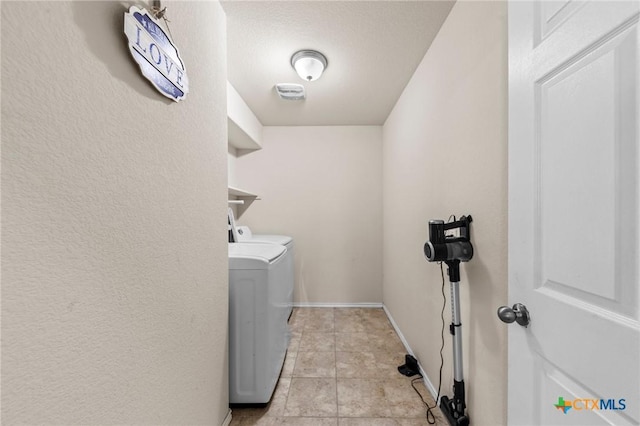 1401 Juneberry Park Dr, Temple, TX 76502 - laundry room with washing machine and dryer and baseboards