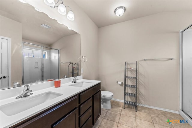 1401 Juneberry Park Dr, Temple, TX 76502 - bathroom with a stall shower, double vanity, toilet, baseboards, and tile patterned floors