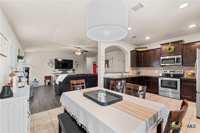 1401 Juneberry Park Dr, Temple, TX 76502 - dining space featuring light tile patterned floors, a ceiling fan, recessed lighting, and lofted ceiling