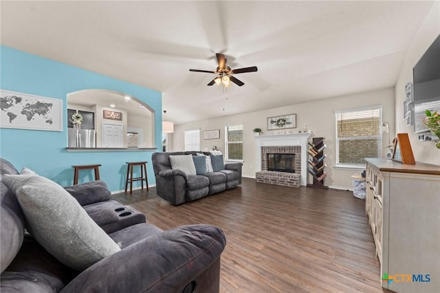 1401 Juneberry Park Dr, Temple, TX 76502 - living room with wood finished floors, ceiling fan, baseboards, and a brick fireplace
