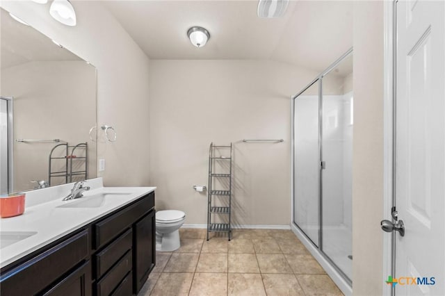 1401 Juneberry Park Dr, Temple, TX 76502 - full bath featuring double vanity, a stall shower, toilet, vaulted ceiling, and tile patterned floors