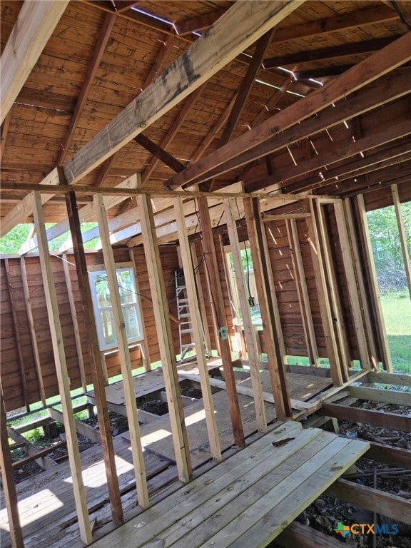 misc room featuring lofted ceiling with beams