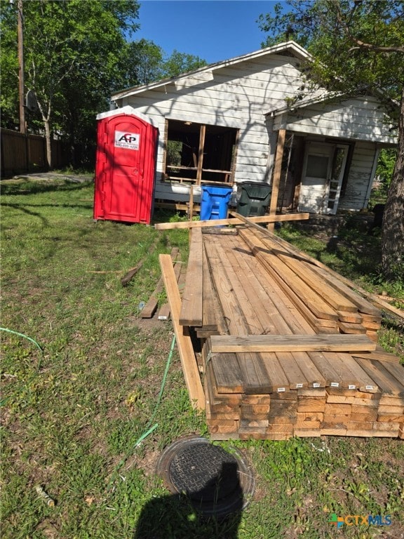 deck featuring a lawn and fence