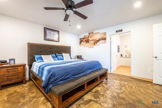 carpeted bedroom featuring connected bathroom and ceiling fan