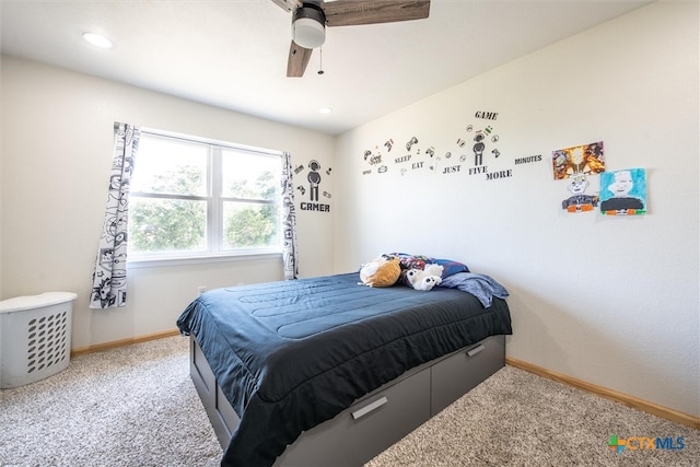 bedroom with ceiling fan and carpet