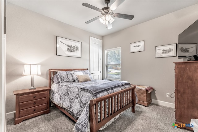 bedroom with ceiling fan and light carpet