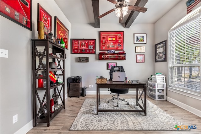 office with light hardwood / wood-style floors, beamed ceiling, and ceiling fan