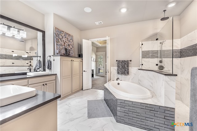 bathroom with independent shower and bath and vanity