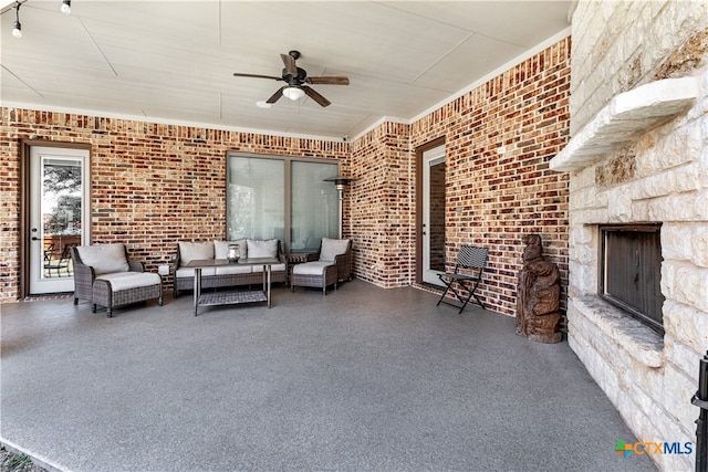 view of patio / terrace with ceiling fan and an outdoor hangout area