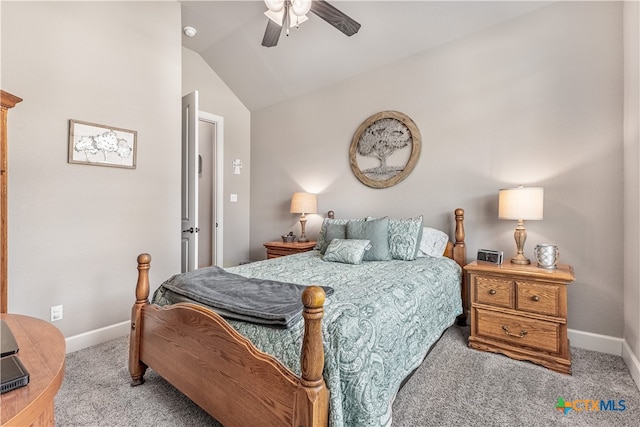 carpeted bedroom with ceiling fan and vaulted ceiling