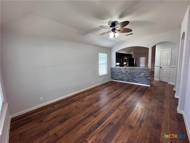 interior space with dark wood-type flooring and ceiling fan