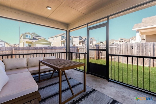 sunroom with a residential view