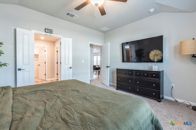 bedroom with vaulted ceiling, carpet, visible vents, and baseboards