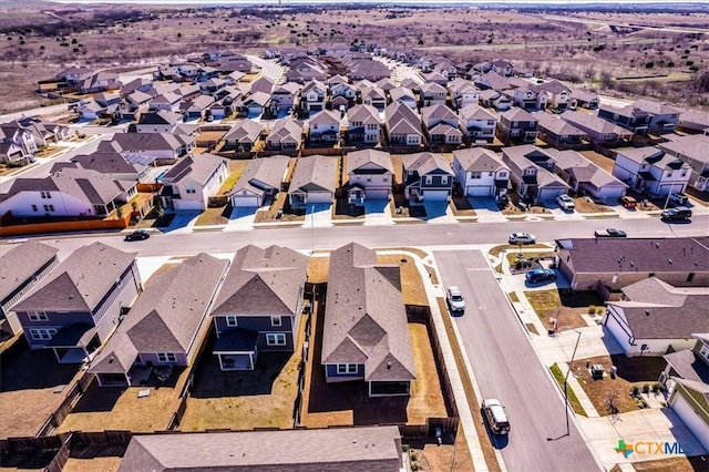 birds eye view of property with a residential view