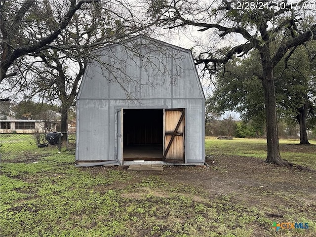 view of outdoor structure with a lawn