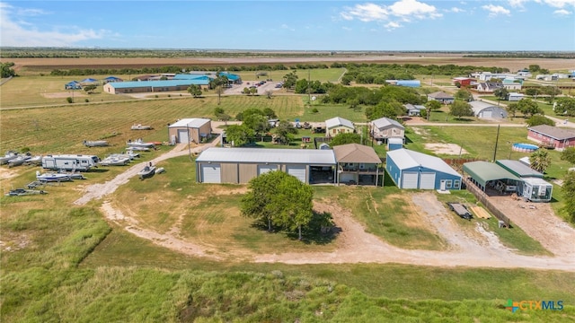 birds eye view of property featuring a rural view