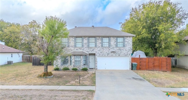 2703 Schulze Dr, Killeen, TX 76549 - traditional-style house with fence, an attached garage, and concrete driveway