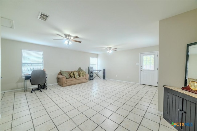 2703 Schulze Dr, Killeen, TX 76549 - living area with ceiling fan, baseboards, and light tile patterned floors