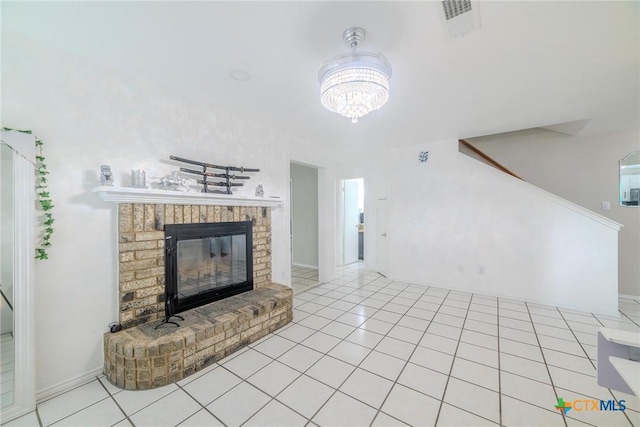 2703 Schulze Dr, Killeen, TX 76549 - unfurnished living room with a chandelier, a fireplace, stairs, and tile patterned floors