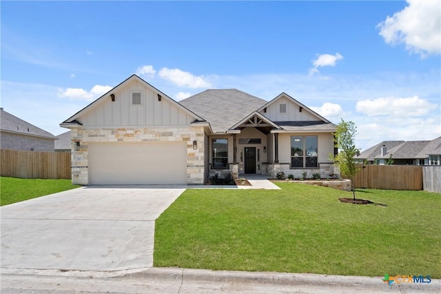 7915 Autumnwood Ln, Temple, TX 76502 - view of front of property with board and batten siding, a garage, driveway, stone siding, and roof with shingles