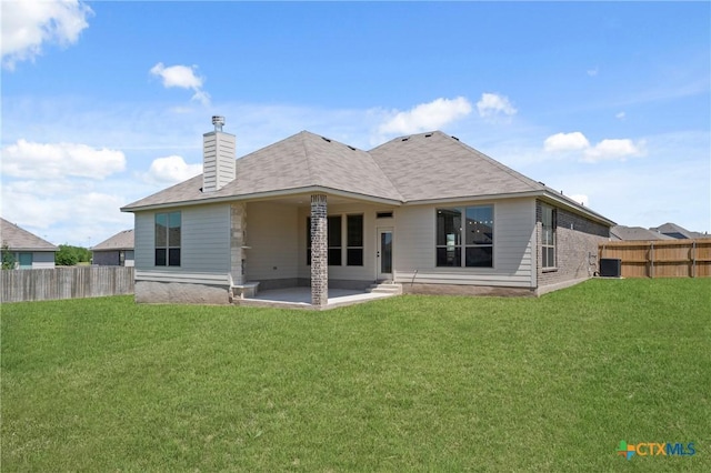7915 Autumnwood Ln, Temple, TX 76502 - back of property with a patio area, central AC unit, and a chimney