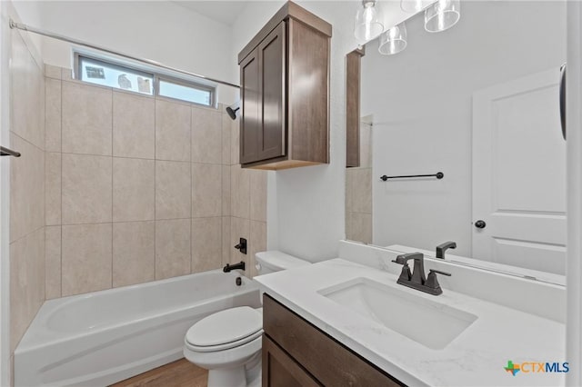 7915 Autumnwood Ln, Temple, TX 76502 - bathroom featuring vanity, toilet, shower / bath combination, and wood finished floors