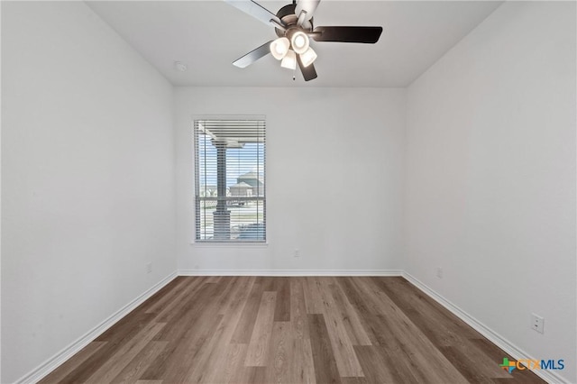 7915 Autumnwood Ln, Temple, TX 76502 - spare room with wood finished floors, ceiling fan, and baseboards