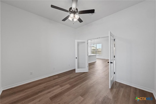 7915 Autumnwood Ln, Temple, TX 76502 - unfurnished room featuring ceiling fan, wood finished floors, and baseboards