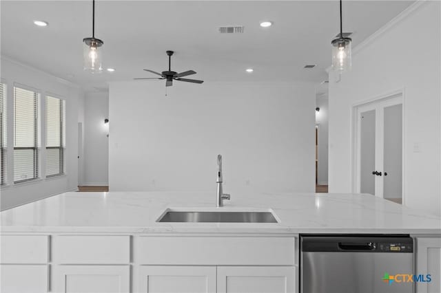 7915 Autumnwood Ln, Temple, TX 76502 - kitchen with dishwasher, a sink, crown molding, white cabinetry, and recessed lighting
