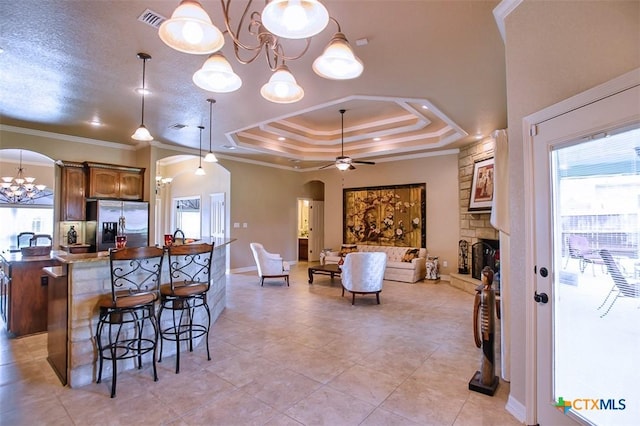 2601 Techny Dr, Harker Heights, TX 76548 - kitchen featuring arched walkways, stainless steel fridge, a chandelier, ceiling fan, and a raised ceiling