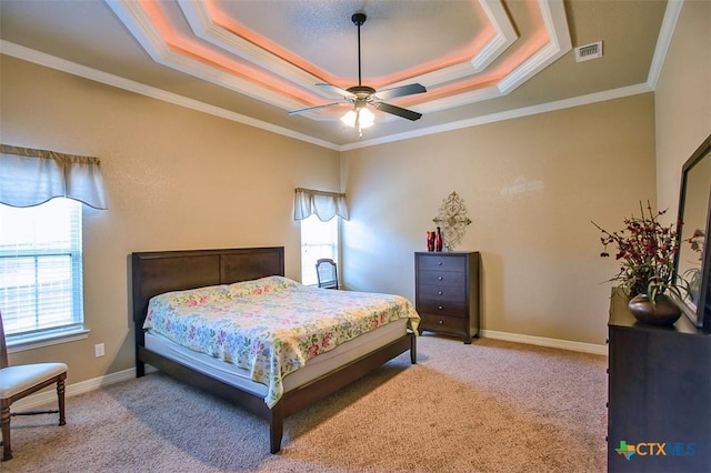 2601 Techny Dr, Harker Heights, TX 76548 - bedroom with a tray ceiling, light carpet, ornamental molding, and a ceiling fan