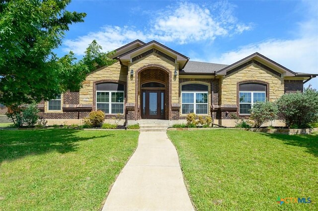 2601 Techny Dr, Harker Heights, TX 76548 - view of front facade featuring a front yard, brick siding, and stone siding