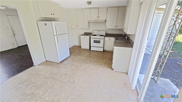 kitchen with white cabinetry, light hardwood / wood-style floors, sink, and white appliances