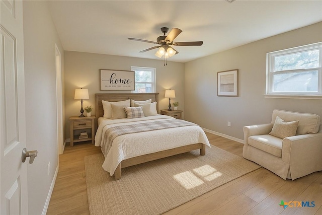 312 S Willis St, Lampasas, TX 76550 - bedroom featuring light wood finished floors, baseboards, and a ceiling fan