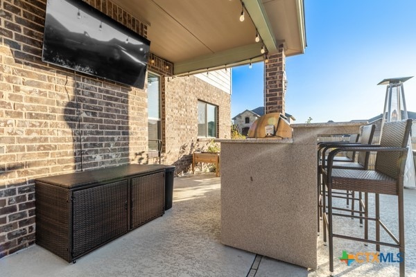 view of patio / terrace with an outdoor bar