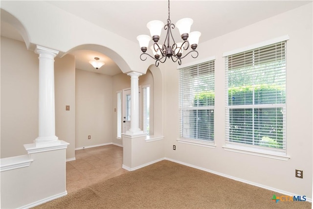 10113 Orion Dr, Temple, TX 76502 - spare room with arched walkways, a healthy amount of sunlight, light carpet, and an inviting chandelier