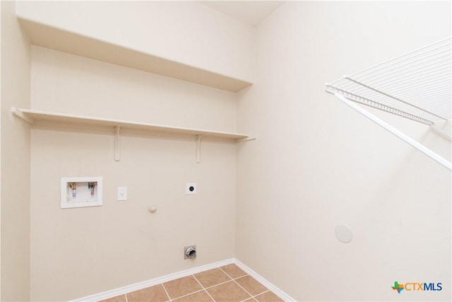 10113 Orion Dr, Temple, TX 76502 - clothes washing area with baseboards, hookup for a washing machine, electric dryer hookup, gas dryer hookup, and laundry area