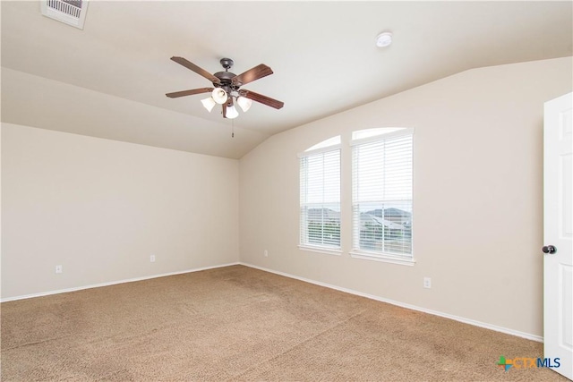 10113 Orion Dr, Temple, TX 76502 - carpeted empty room featuring lofted ceiling, visible vents, a ceiling fan, and baseboards
