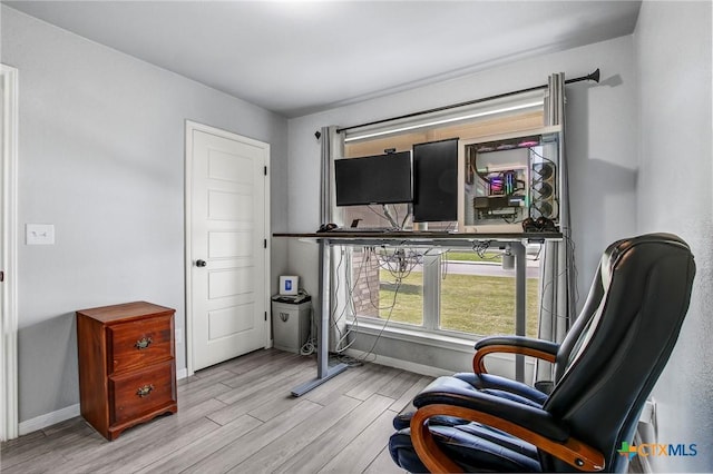 living area featuring wood finished floors and baseboards