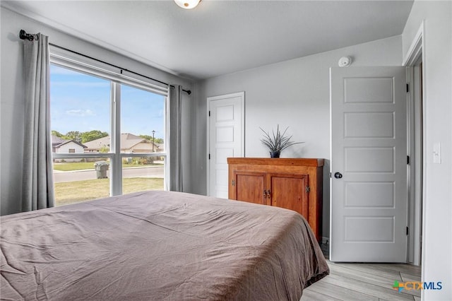 bedroom with light wood finished floors
