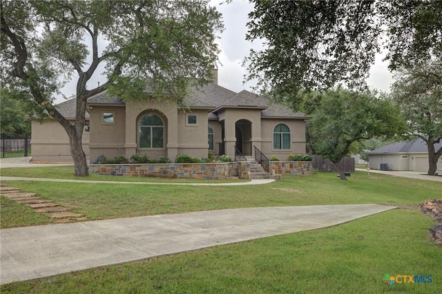 217 Foxwood, New Braunfels, TX 78132 - view of front of house with a front lawn, roof with shingles, stucco siding, and a chimney
