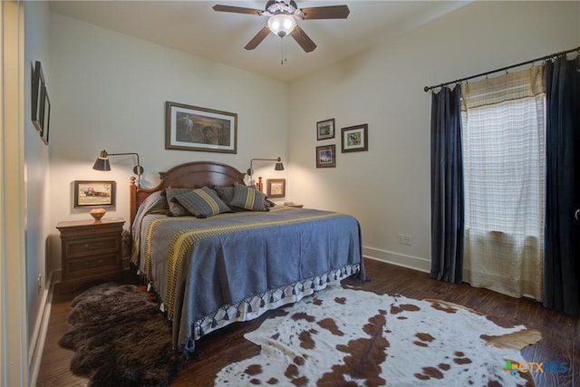 217 Foxwood, New Braunfels, TX 78132 - bedroom with a ceiling fan, baseboards, and wood finished floors