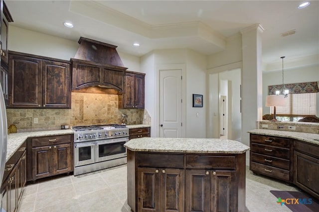 217 Foxwood, New Braunfels, TX 78132 - kitchen featuring double oven range, tasteful backsplash, ornamental molding, custom range hood, and recessed lighting