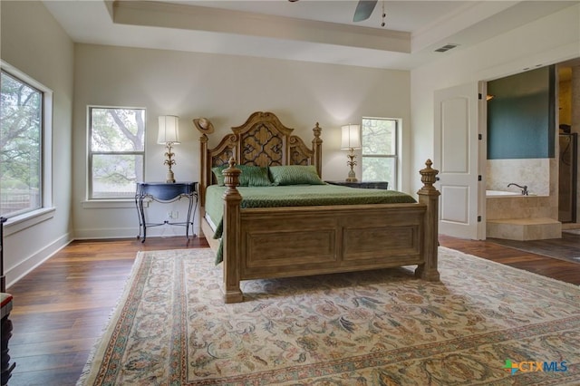 217 Foxwood, New Braunfels, TX 78132 - bedroom featuring visible vents, ornamental molding, wood finished floors, and a tray ceiling