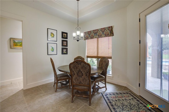 217 Foxwood, New Braunfels, TX 78132 - tiled dining area featuring baseboards, a chandelier, ornamental molding, and a tray ceiling