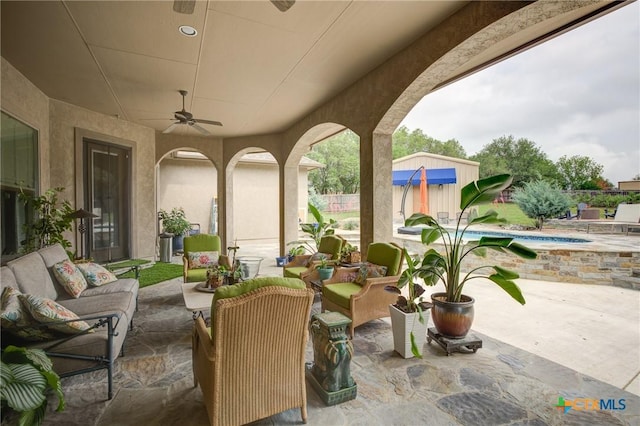 217 Foxwood, New Braunfels, TX 78132 - view of patio with an outdoor structure, ceiling fan, a hot tub, and outdoor lounge area