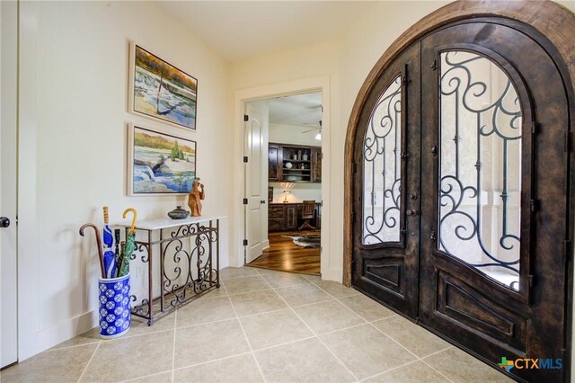 217 Foxwood, New Braunfels, TX 78132 - entryway featuring french doors, arched walkways, and tile patterned floors