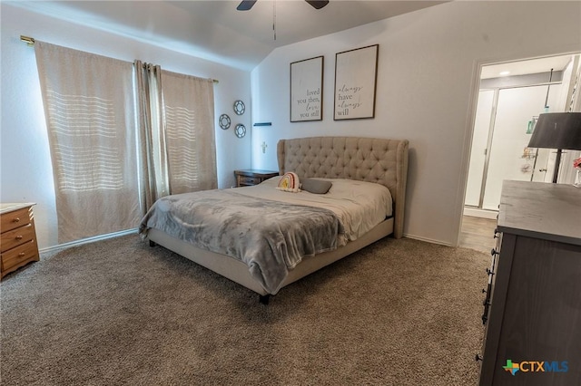 bedroom featuring light colored carpet, vaulted ceiling, and ceiling fan