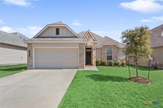 view of front of house featuring an attached garage, brick siding, driveway, a front lawn, and board and batten siding