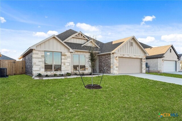 view of front of home featuring a front yard and a garage